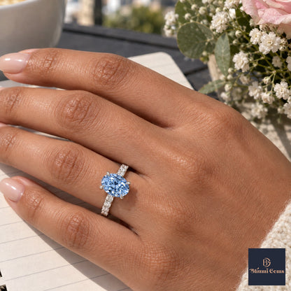 Blue Oval Cut Lab Grown Diamond Engagement Ring - Cathedral Pave Band in white gold, worn on the hand