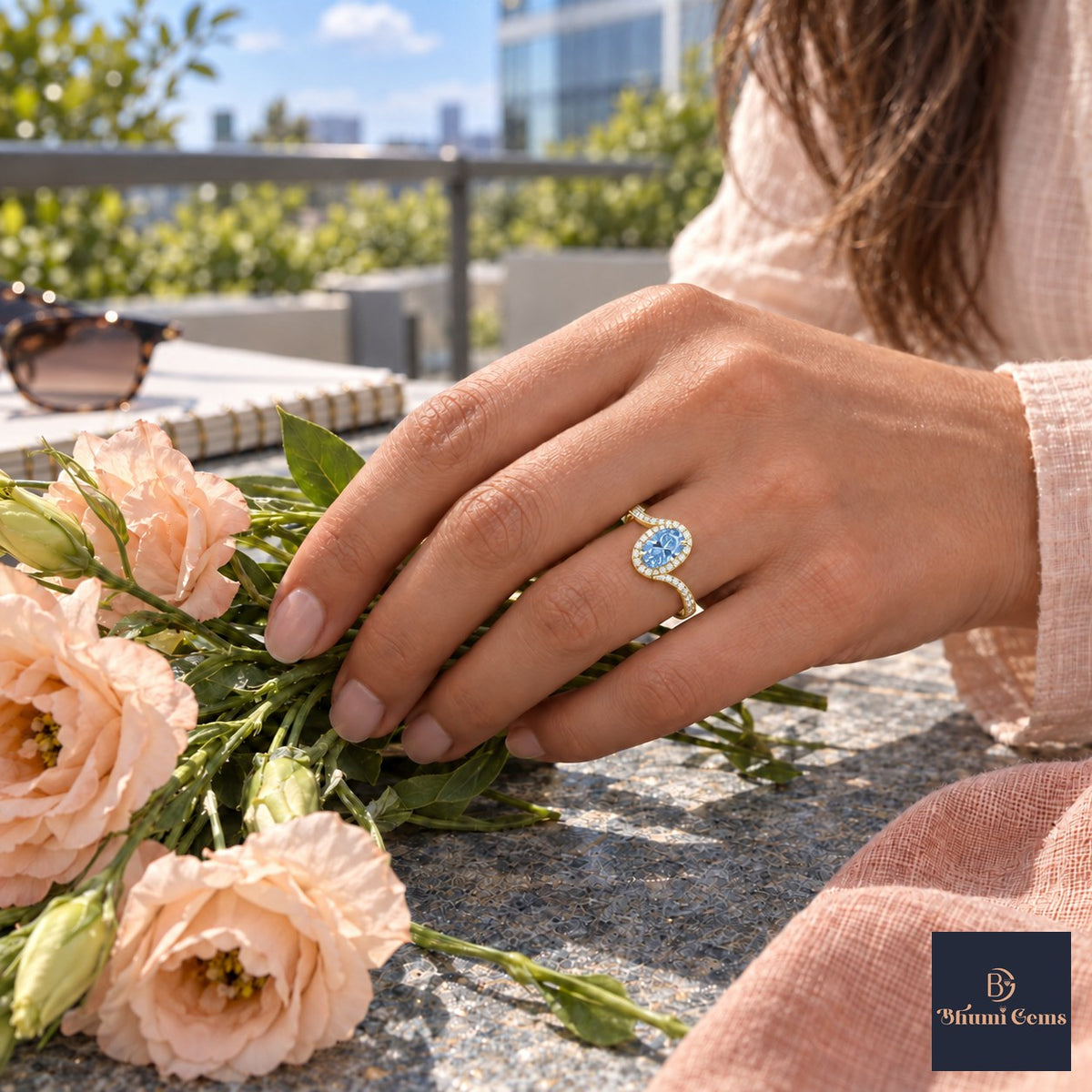 Blue Oval Cut Lab Grown Diamond Engagement Ring - Halo Bypass in yellow gold, worn on the hand