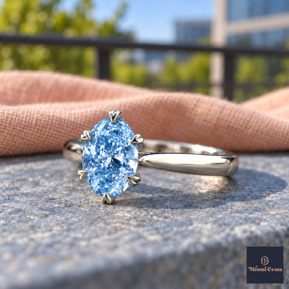 Blue Oval Cut Lab Grown Diamond Engagement Ring - Heart Prong Solitaire in white gold, close-up
