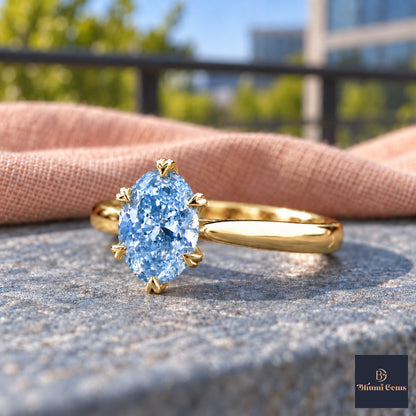 Blue Oval Cut Lab Grown Diamond Engagement Ring - Heart Prong Solitaire in yellow gold, close-up