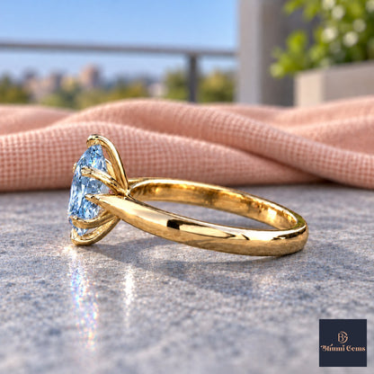 Blue Oval Cut Lab Grown Diamond Engagement Ring - Heart Prong Solitaire in yellow gold, side view