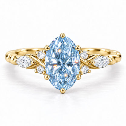 Blue Oval Cut Lab Grown Diamond Engagement Ring - Leaf Cluster Shoulders in yellow gold, front view