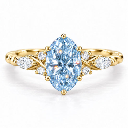 Blue Oval Cut Lab Grown Diamond Engagement Ring - Leaf Cluster Shoulders in yellow gold, front view