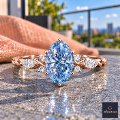 Blue Oval Cut Lab Grown Diamond Engagement Ring - Leaf Cluster Shoulders in rose gold, close-up