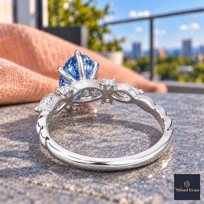 Blue Oval Cut Lab Grown Diamond Engagement Ring - Leaf Cluster Shoulders in white gold, gallery view