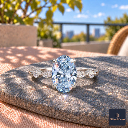 Blue Oval Cut Lab Grown Diamond Engagement Ring - Marquise and Round Accents in white gold, close-up