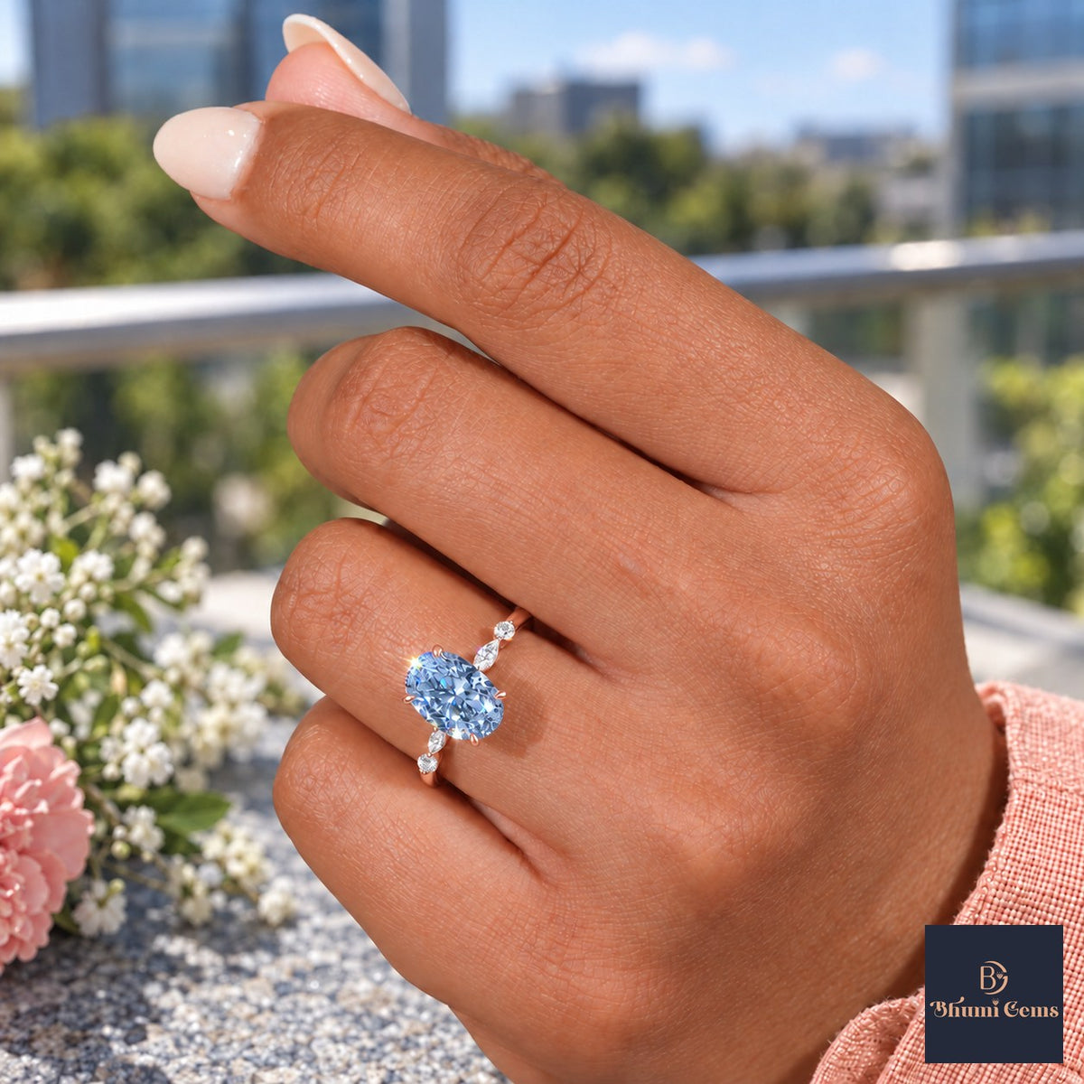 Blue Oval Cut Lab Grown Diamond Engagement Ring - Marquise and Round Accents in rose gold, worn on the hand