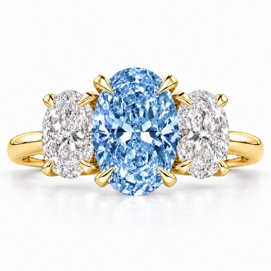 Blue Oval Cut Lab Grown Diamond Engagement Ring - Oval Three Stone in yellow gold, front view