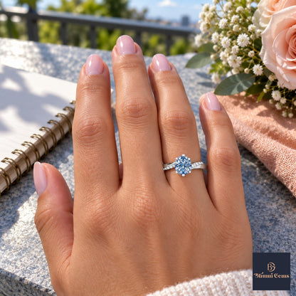Blue Oval Cut Lab Grown Diamond Engagement Ring - Pave Twist Bypass in white gold, worn on the hand
