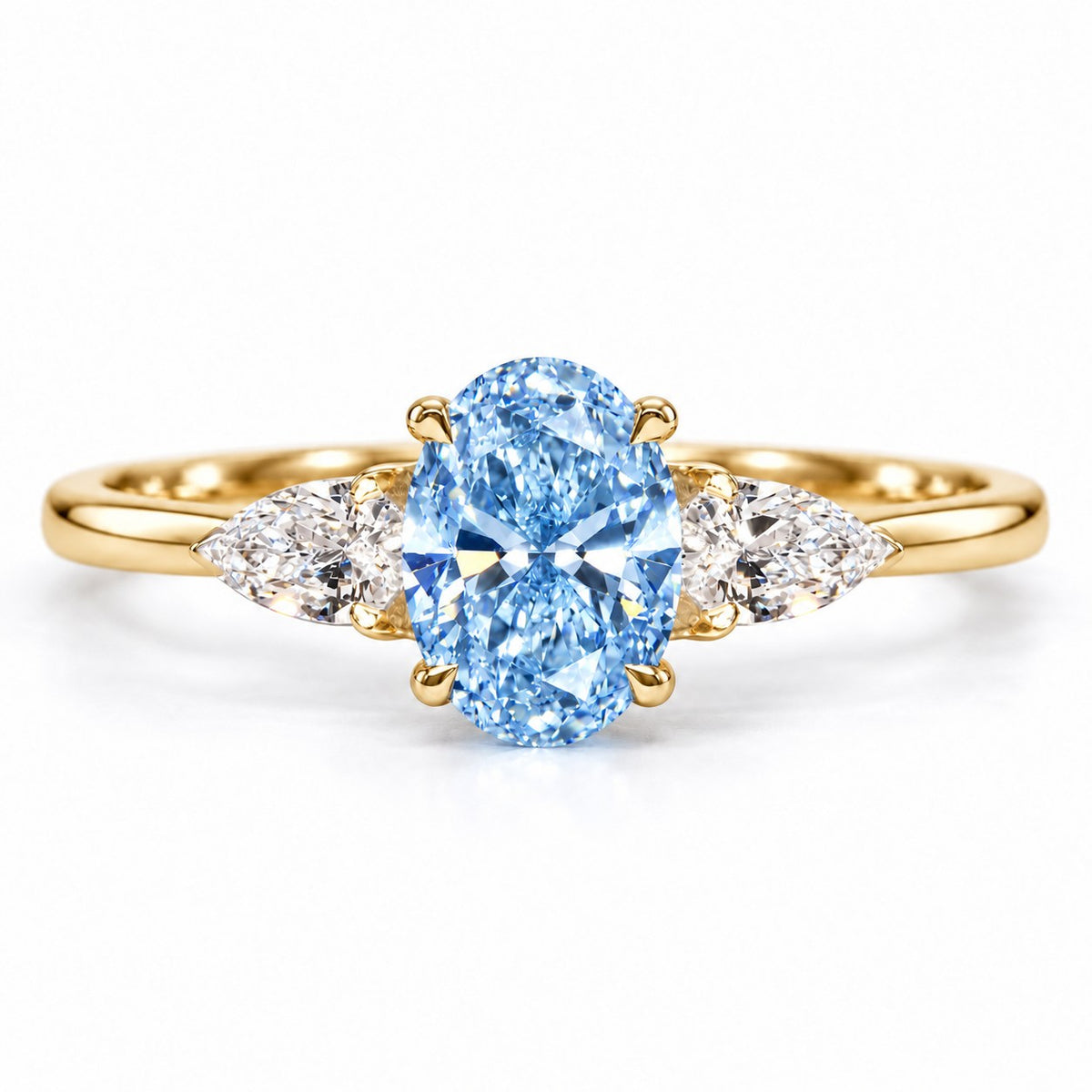 Blue Oval Cut Lab Grown Diamond Engagement Ring - Pear Side Stones in yellow gold, front view