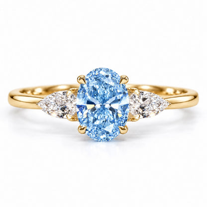 Blue Oval Cut Lab Grown Diamond Engagement Ring - Pear Side Stones in yellow gold, front view