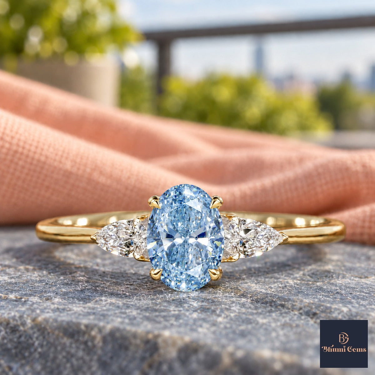 Blue Oval Cut Lab Grown Diamond Engagement Ring - Pear Side Stones in yellow gold, close-up