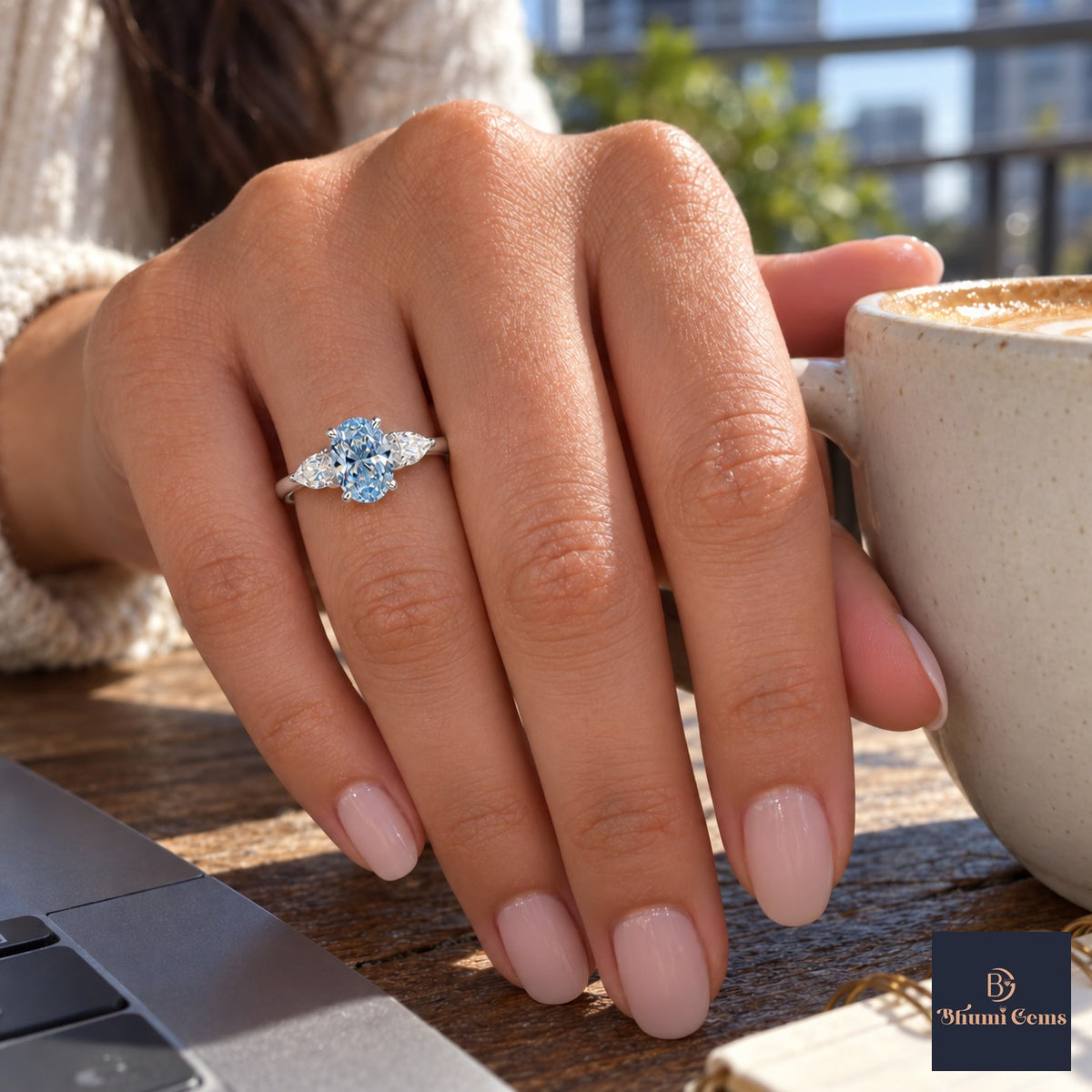 Blue Oval Cut Lab Grown Diamond Engagement Ring - Pear Side Stones in white gold, on the hand