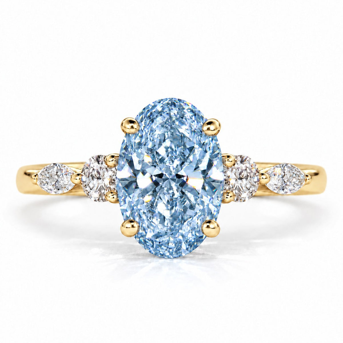 Blue Oval Cut Lab Grown Diamond Engagement Ring - Round and Marquise Accents in yellow gold, front view