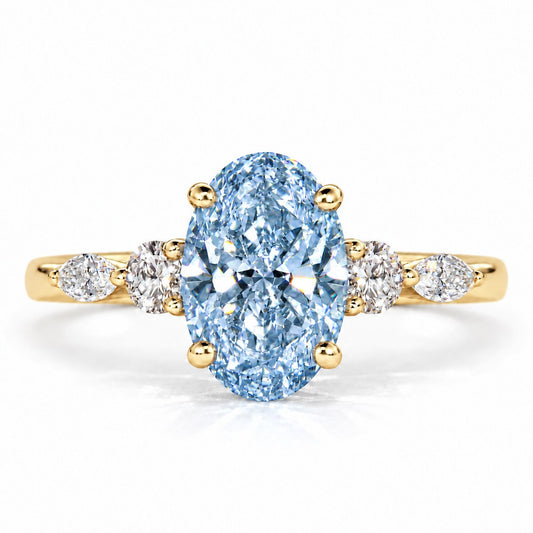 Blue Oval Cut Lab Grown Diamond Engagement Ring - Round and Marquise Accents in yellow gold, front view