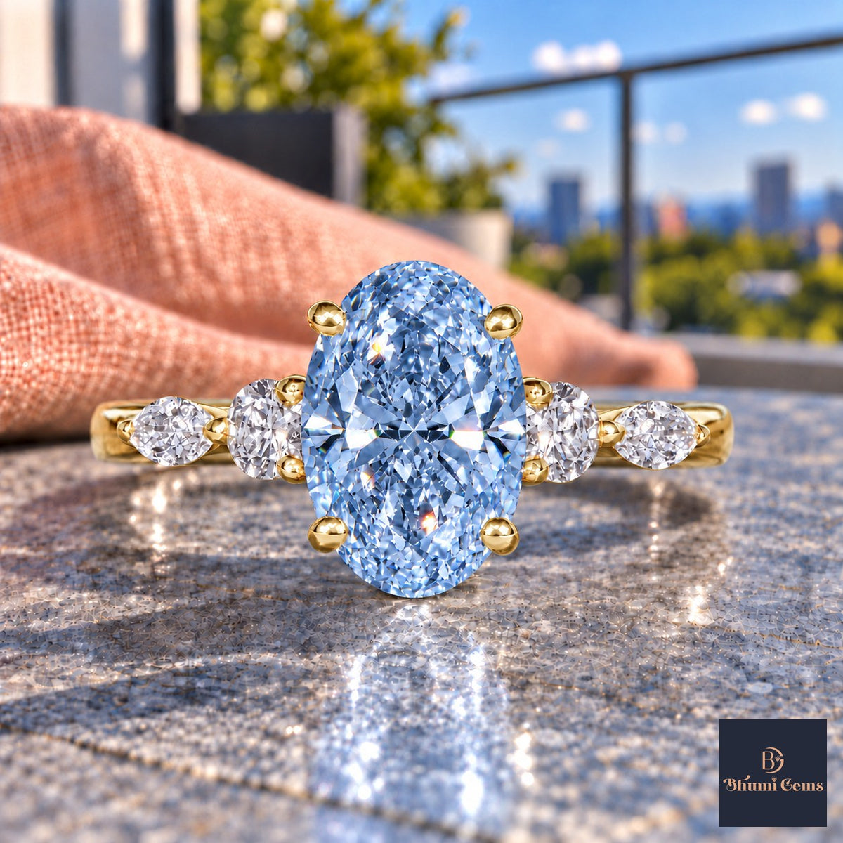 Blue Oval Cut Lab Grown Diamond Engagement Ring - Round and Marquise Accents in yellow gold, close-up