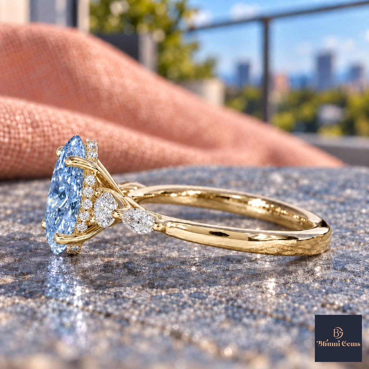 Blue Oval Cut Lab Grown Diamond Engagement Ring - Round and Marquise Accents in yellow gold, side view