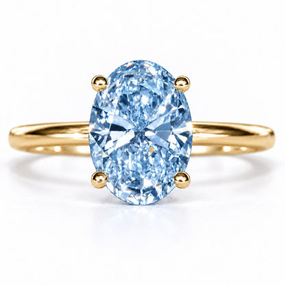 Blue Oval Cut Lab Grown Diamond Engagement Ring - Six Prong Solitaire in yellow gold, front view