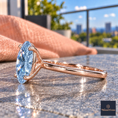 Blue Oval Cut Lab Grown Diamond Engagement Ring - Six Prong Solitaire in rose gold, side view