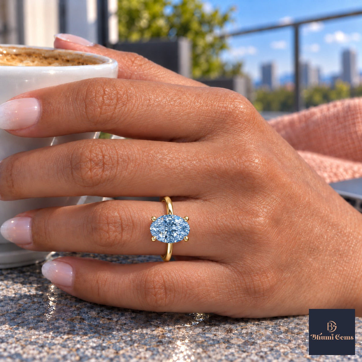 Blue Oval Cut Lab Grown Diamond Engagement Ring - Six Prong Solitaire in yellow gold, on the hand