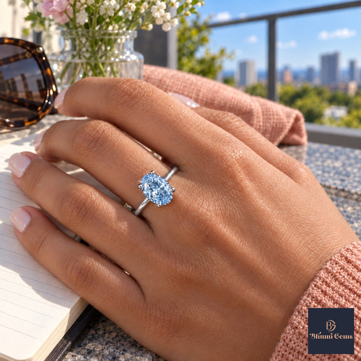 Blue Oval Cut Lab Grown Diamond Engagement Ring - Six Prong Solitaire in white gold, worn on the hand