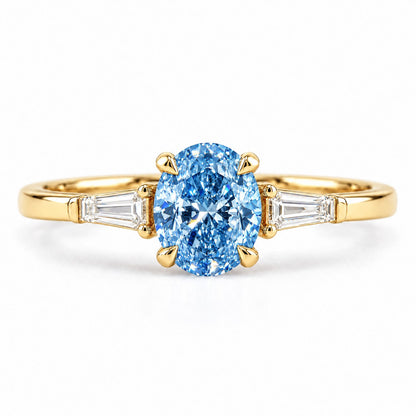 Blue Oval Cut Lab Grown Diamond Engagement Ring - Tapered Baguettes in yellow gold, front view