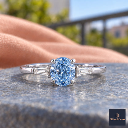 Blue Oval Cut Lab Grown Diamond Engagement Ring - Tapered Baguettes in white gold, close-up