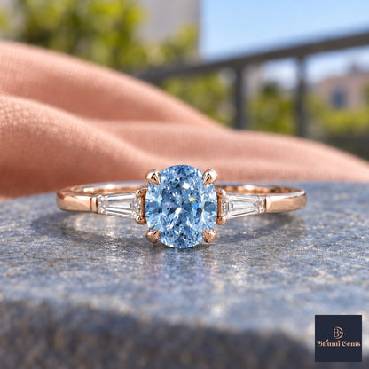 Blue Oval Cut Lab Grown Diamond Engagement Ring - Tapered Baguettes in rose gold, close-up