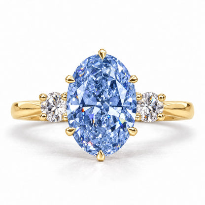 Blue Oval Cut Lab Grown Diamond Engagement Ring - Three Stone in yellow gold, front view