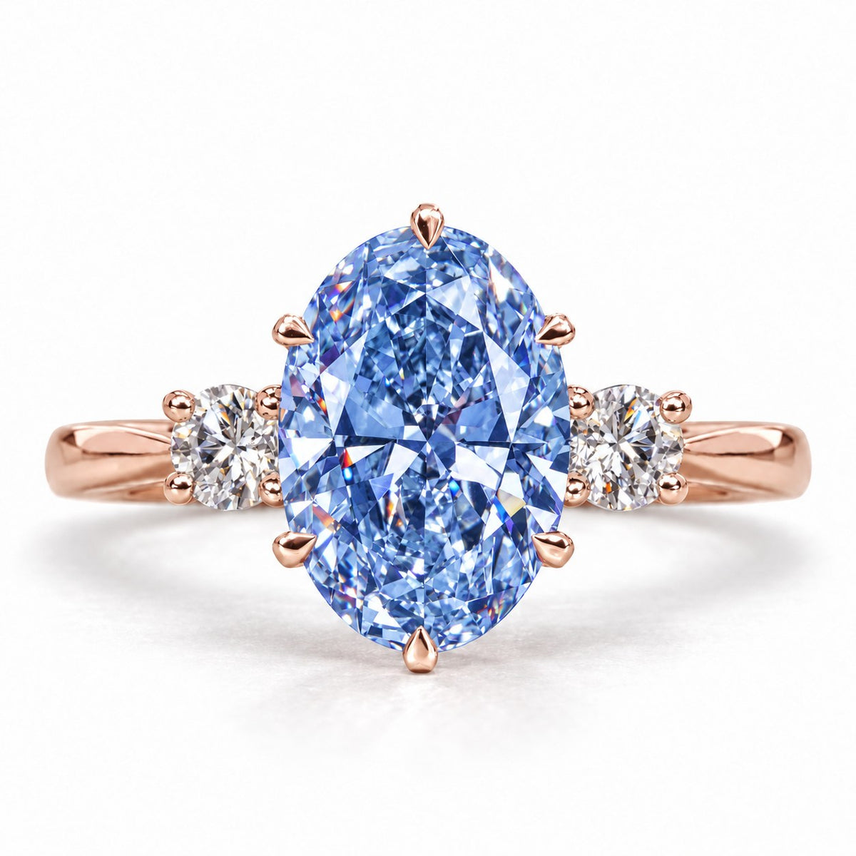 Blue Oval Cut Lab Grown Diamond Engagement Ring - Three Stone in rose gold, front view