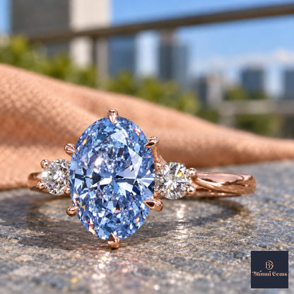 Blue Oval Cut Lab Grown Diamond Engagement Ring - Three Stone in rose gold, close-up