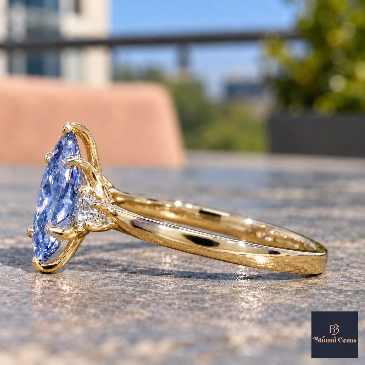 Blue Oval Cut Lab Grown Diamond Engagement Ring - Three Stone in yellow gold, side view