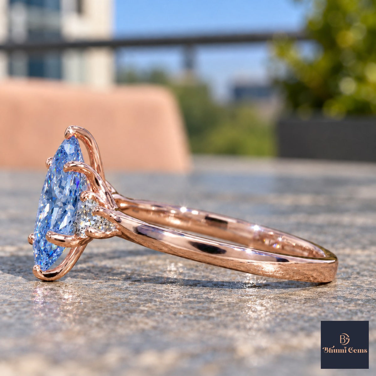Blue Oval Cut Lab Grown Diamond Engagement Ring - Three Stone in rose gold, side view