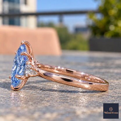 Blue Oval Cut Lab Grown Diamond Engagement Ring - Three Stone in rose gold, side view