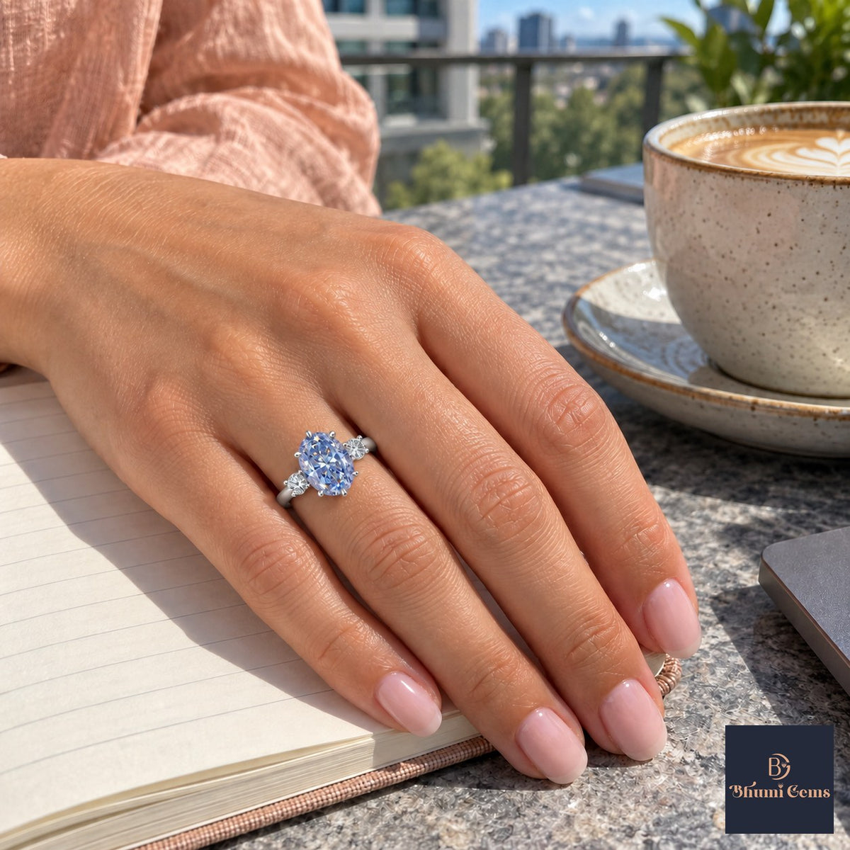 Blue Oval Cut Lab Grown Diamond Engagement Ring - Three Stone in white gold, worn on the hand