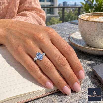 Blue Oval Cut Lab Grown Diamond Engagement Ring - Three Stone in white gold, worn on the hand