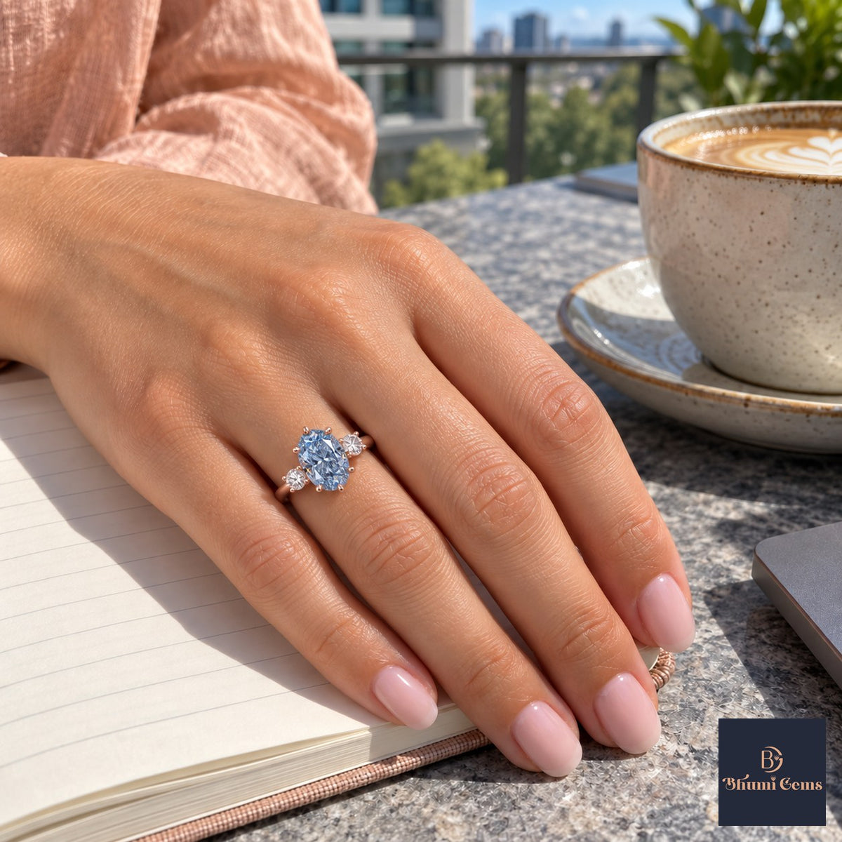 Blue Oval Cut Lab Grown Diamond Engagement Ring - Three Stone in rose gold, worn on the hand