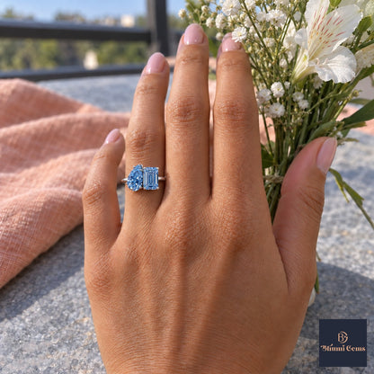 Blue Pear and Emerald Cut Lab Grown Diamond Engagement Ring - Toi et Moi in white gold, worn on the hand