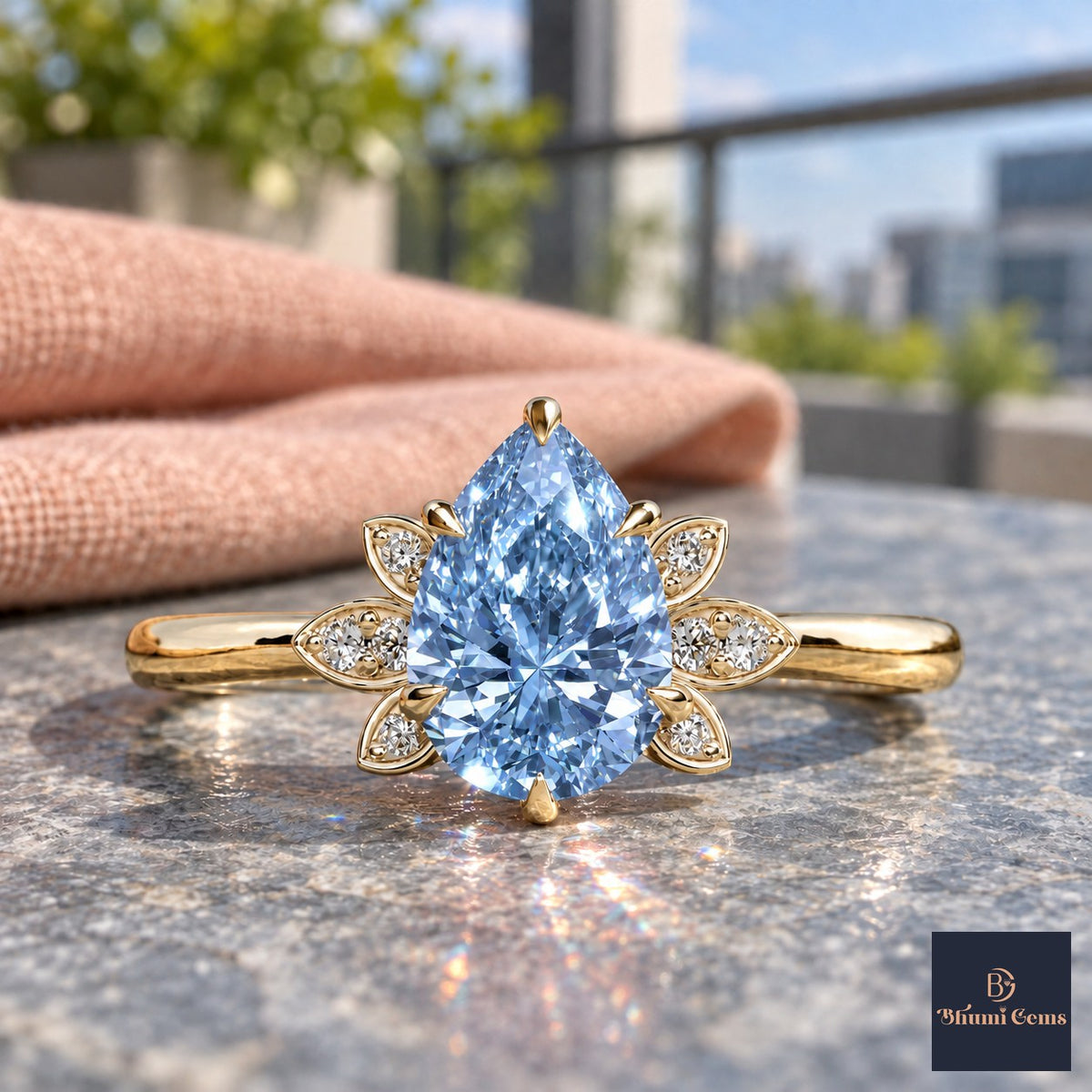 Blue Pear Cut Lab Grown Diamond Engagement Ring - Floral Leaf Accents in yellow gold, close-up