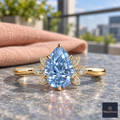 Blue Pear Cut Lab Grown Diamond Engagement Ring - Floral Leaf Accents in yellow gold, close-up