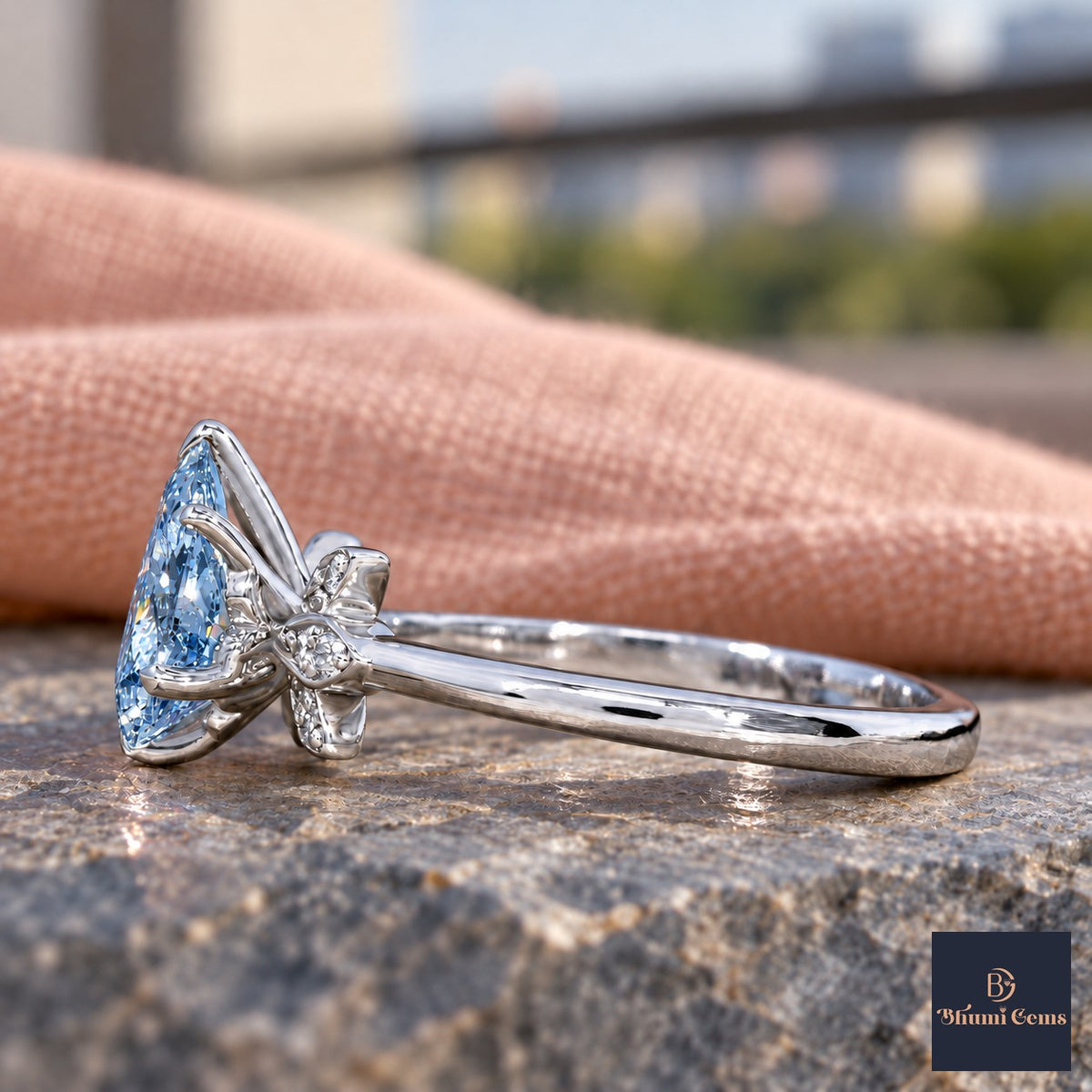 Blue Pear Cut Lab Grown Diamond Engagement Ring - Floral Leaf Accents in white gold, side view
