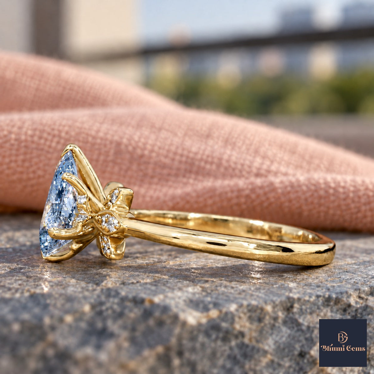 Blue Pear Cut Lab Grown Diamond Engagement Ring - Floral Leaf Accents in yellow gold, side view