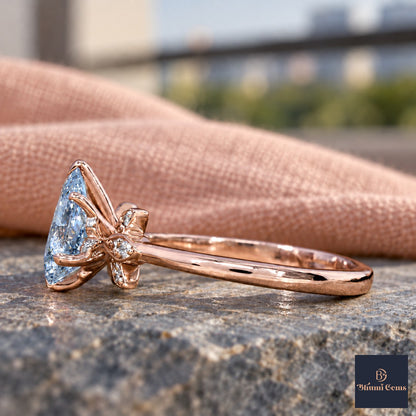 Blue Pear Cut Lab Grown Diamond Engagement Ring - Floral Leaf Accents in rose gold, side view