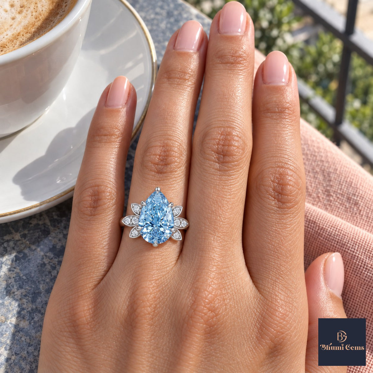 Blue Pear Cut Lab Grown Diamond Engagement Ring - Floral Leaf Accents in white gold, on the hand