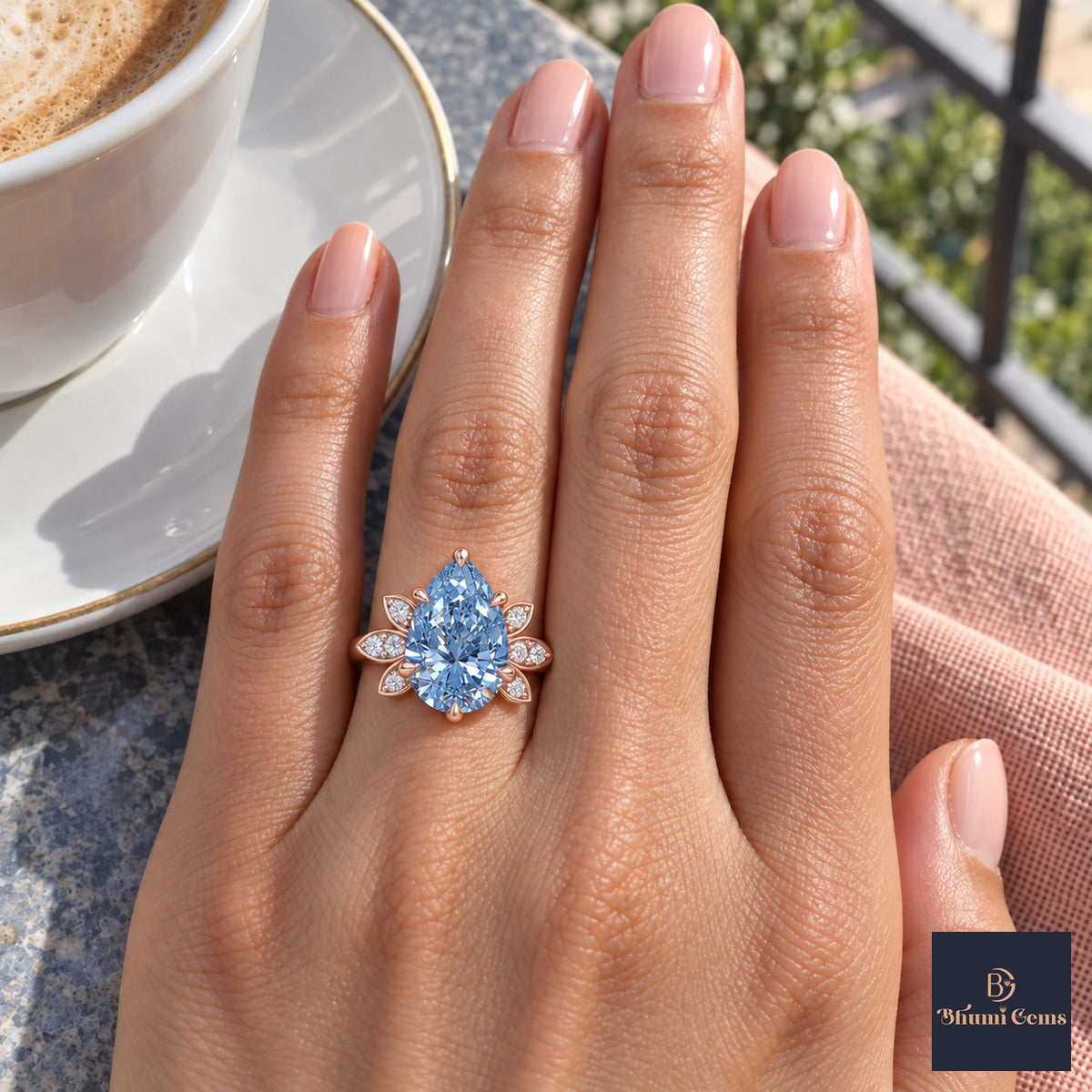 Blue Pear Cut Lab Grown Diamond Engagement Ring - Floral Leaf Accents in rose gold, on the hand