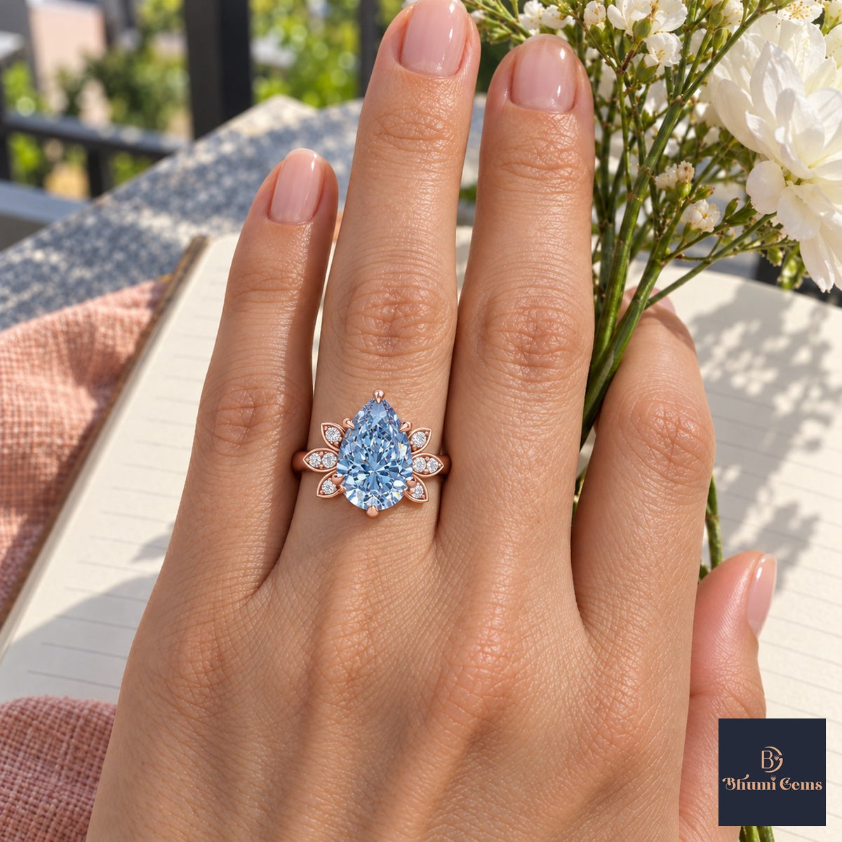 Blue Pear Cut Lab Grown Diamond Engagement Ring - Floral Leaf Accents in rose gold, worn on the hand