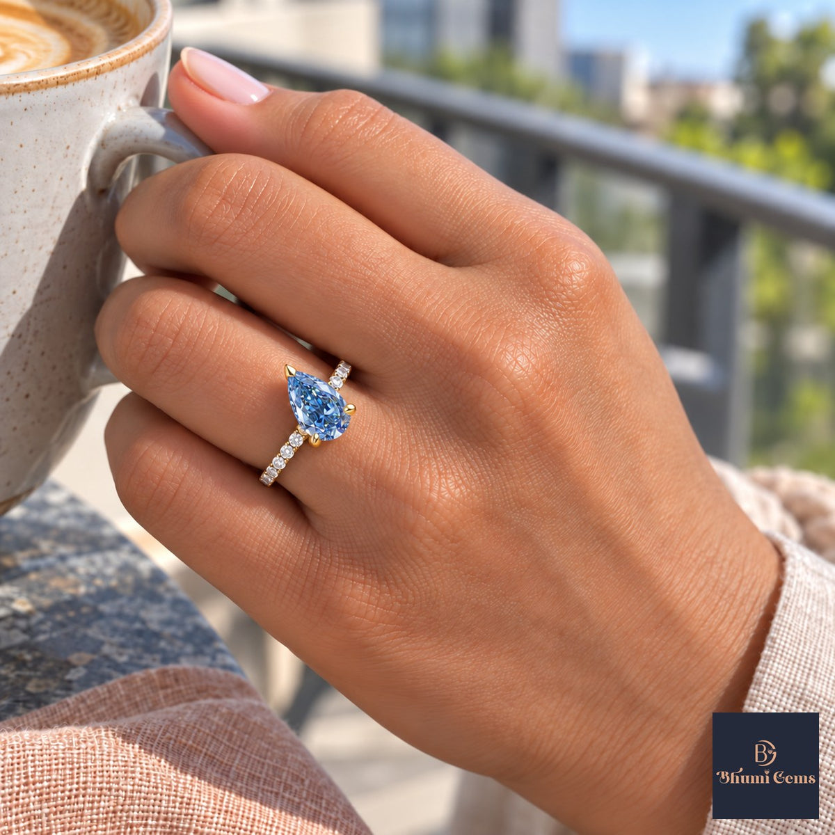 Blue Pear Cut Lab Grown Diamond Engagement Ring - Pave Band in yellow gold, on the hand
