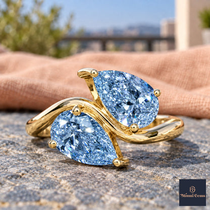 Blue Pear Cut Lab Grown Diamond Engagement Ring - Toi et Moi in yellow gold, close-up