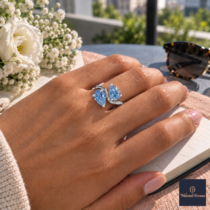 Blue Pear Cut Lab Grown Diamond Engagement Ring - Toi et Moi in white gold, worn on the hand