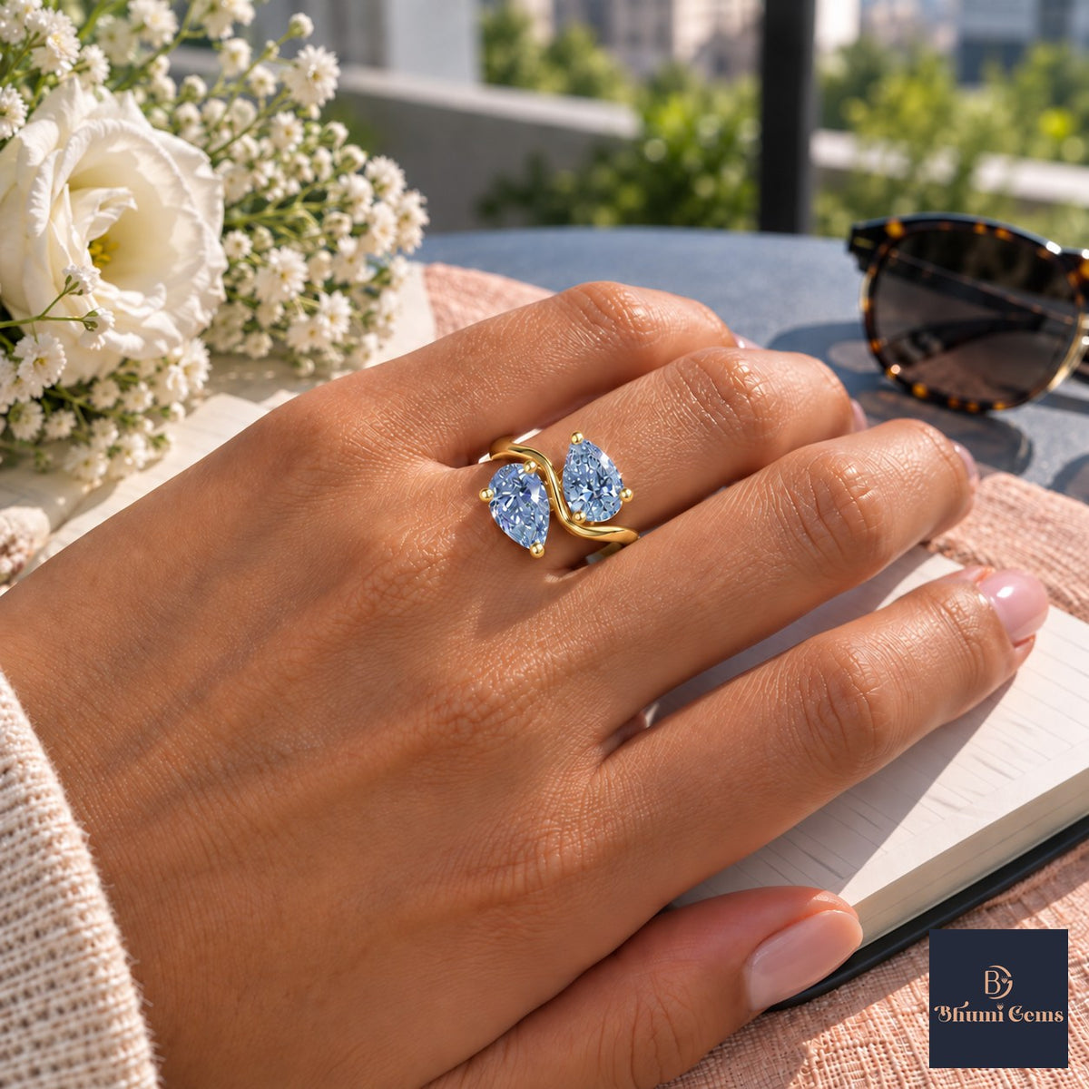 Blue Pear Cut Lab Grown Diamond Engagement Ring - Toi et Moi in yellow gold, worn on the hand